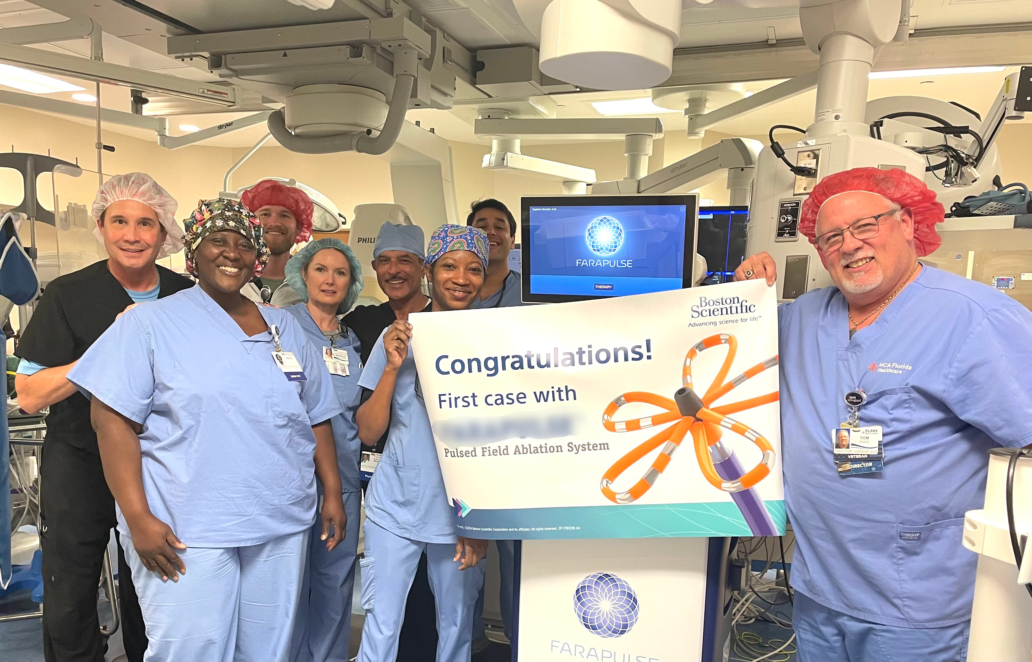 The Blake cardiac team holding congratulations sign, celebrating first non-thermal ablation procedure in Manatee County