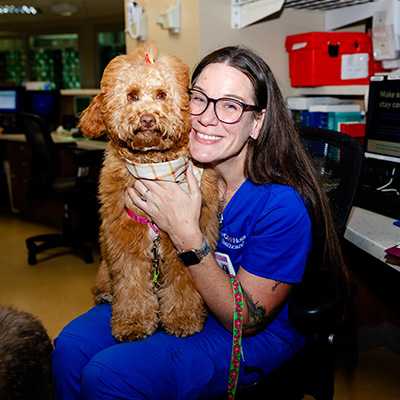 HCA Houston Clear Lake colleague Angela Mueller cuddles with Ginger