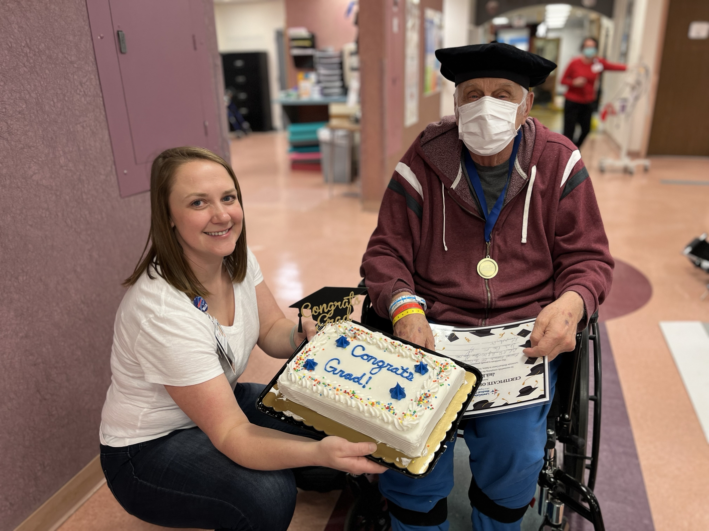 Jack Kingrea and Mariah celebrating his rehab graduation with a cake.