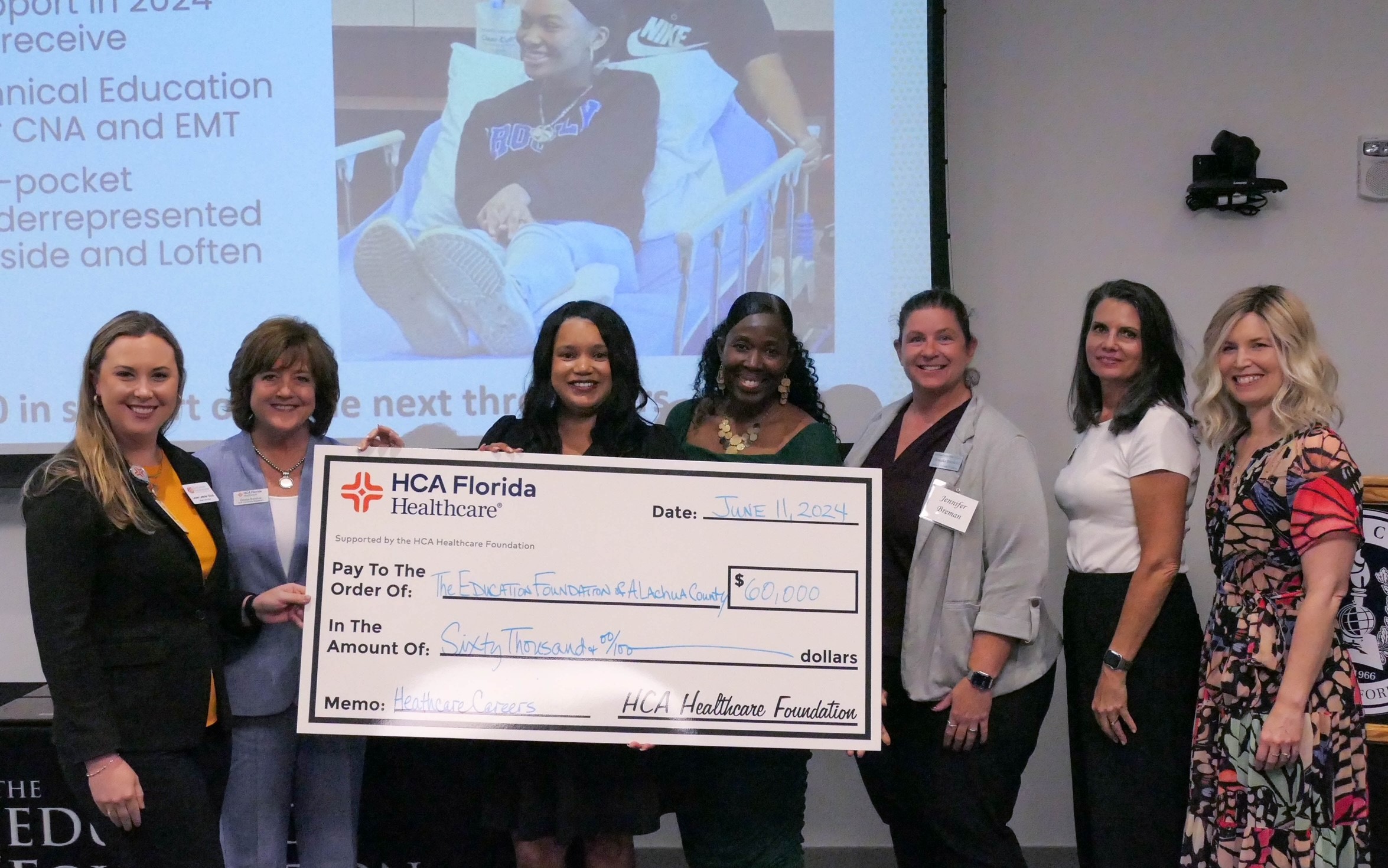 HCA Florida Healthcare colleagues presenting the Education Foundation for a check for $60,000 to use over the next three years to fund healthcare career opportunities.