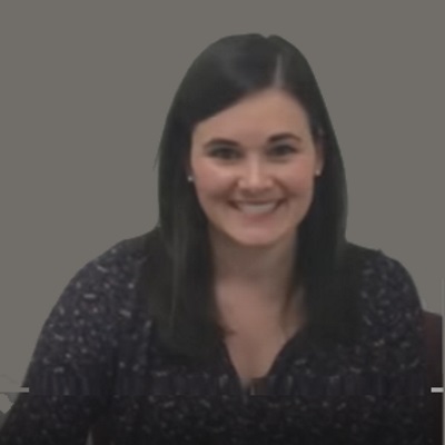 Allyson Mueller smiles and is wearing a black blouse.