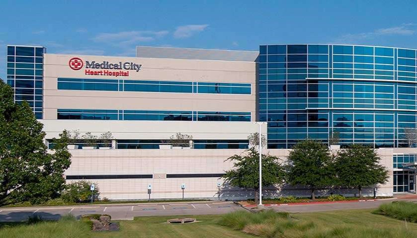 Exterior view of the main entrance to Medical City Heart Hospital on a sunny day.