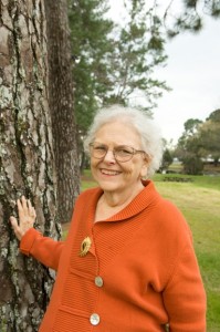 Judibeth Taylor standing outside next to a tree