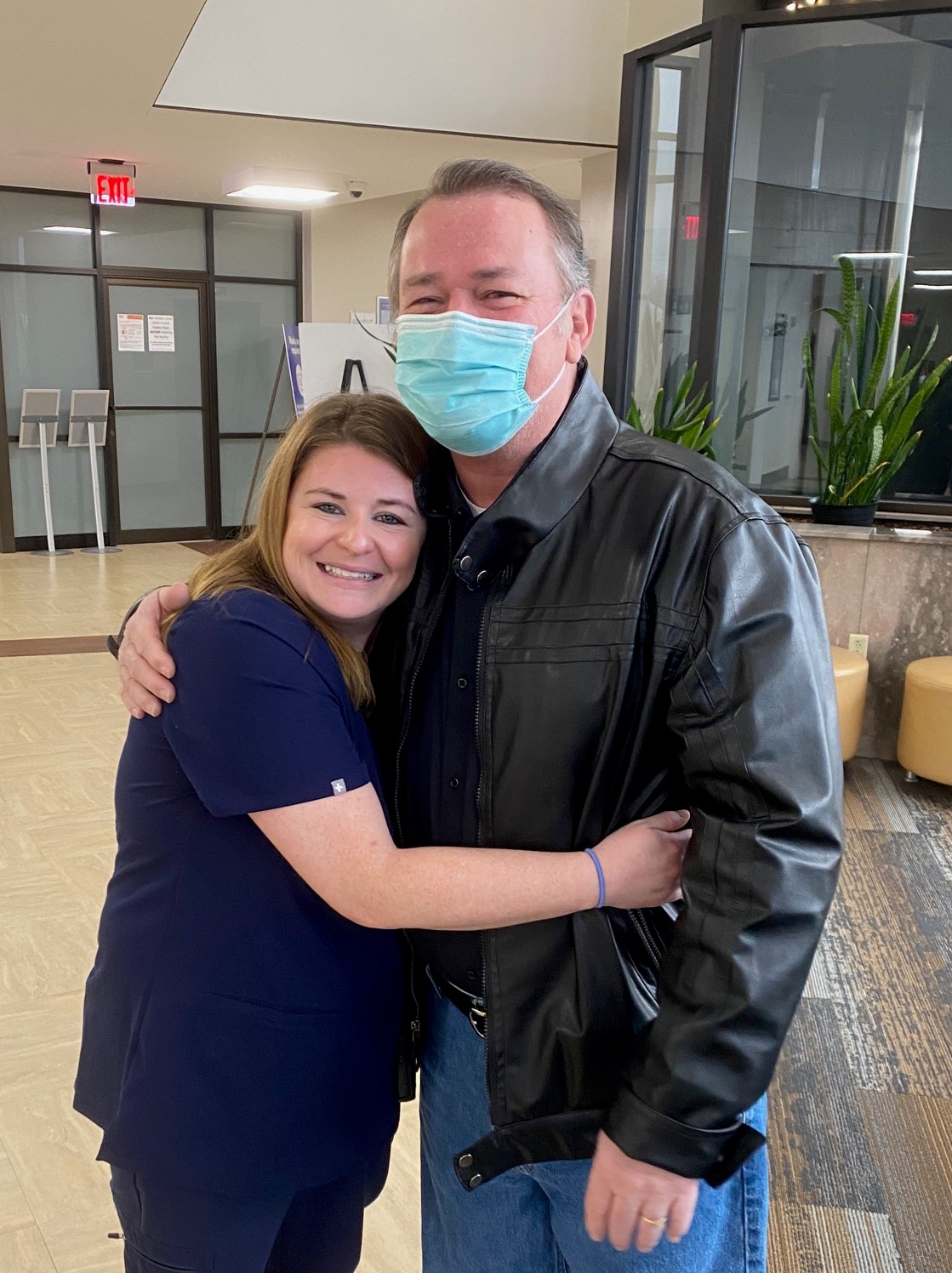 Steven McBride and Kim Williams reunited in hospital lobby.