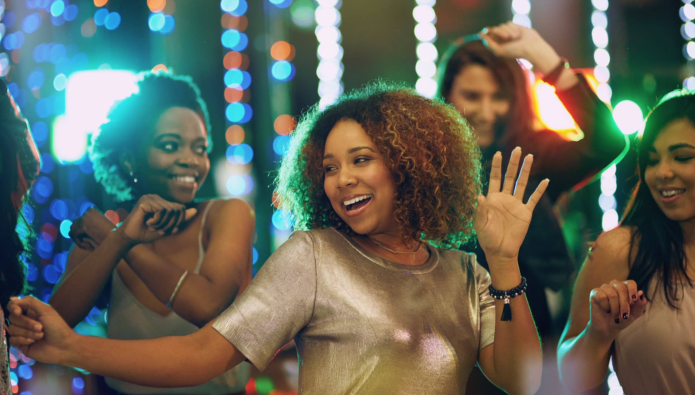 Group of young women dancing and having fun in a nightclub