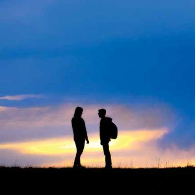 Silhouette of Sandra and Ethan White in the outdoors.