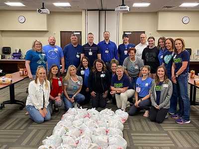 Group shot of employees of Overland Park Regional showing up with their donations.