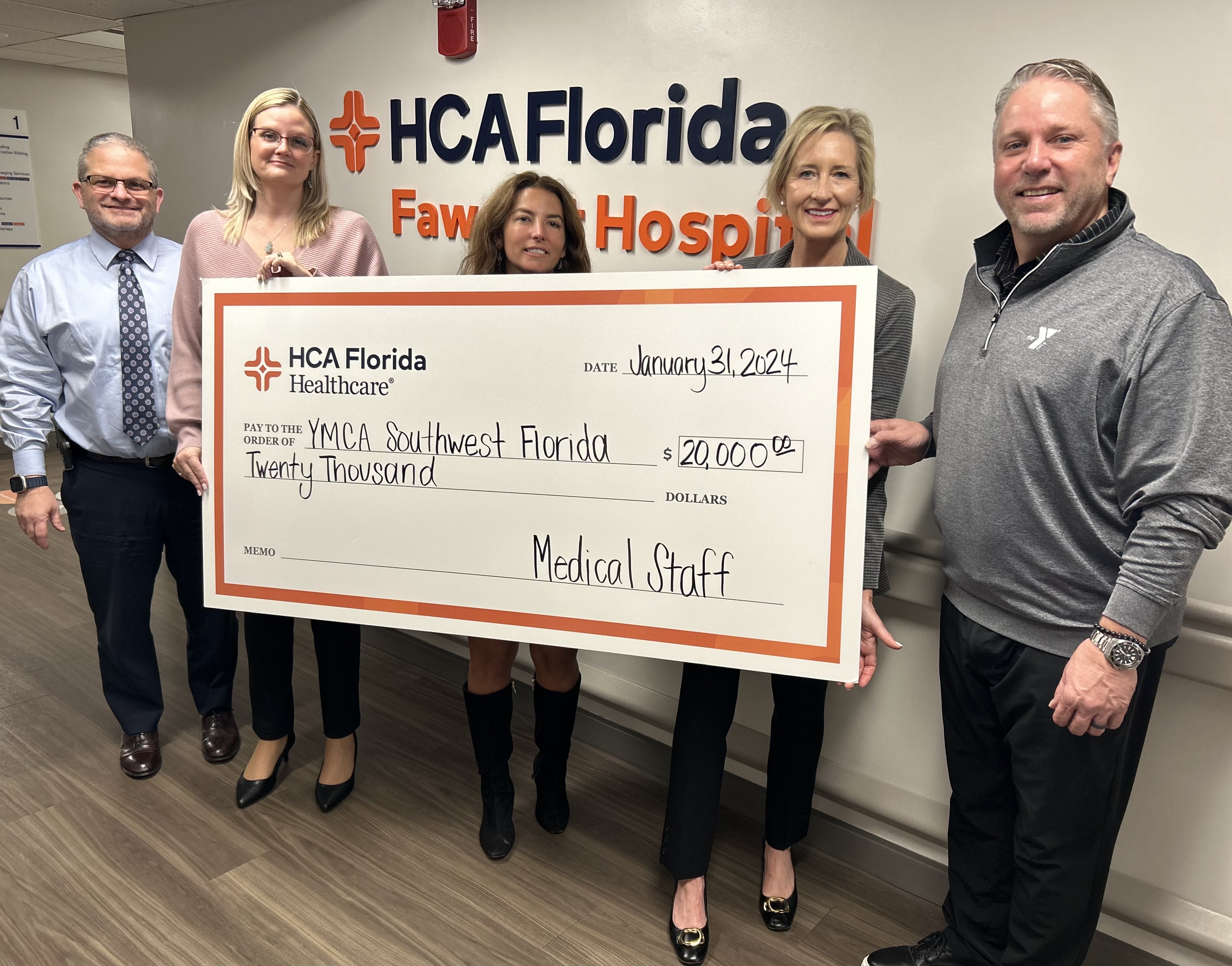 HCA Florida Fawcett Hospital Staff presenting check for YMCA Southwest Florida.