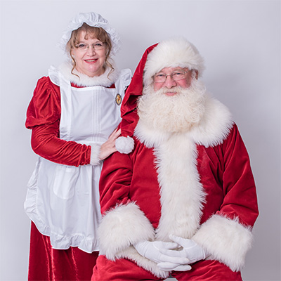 lynne Hulse and his wife dressed up as Santa Clause and Mrs Clause.