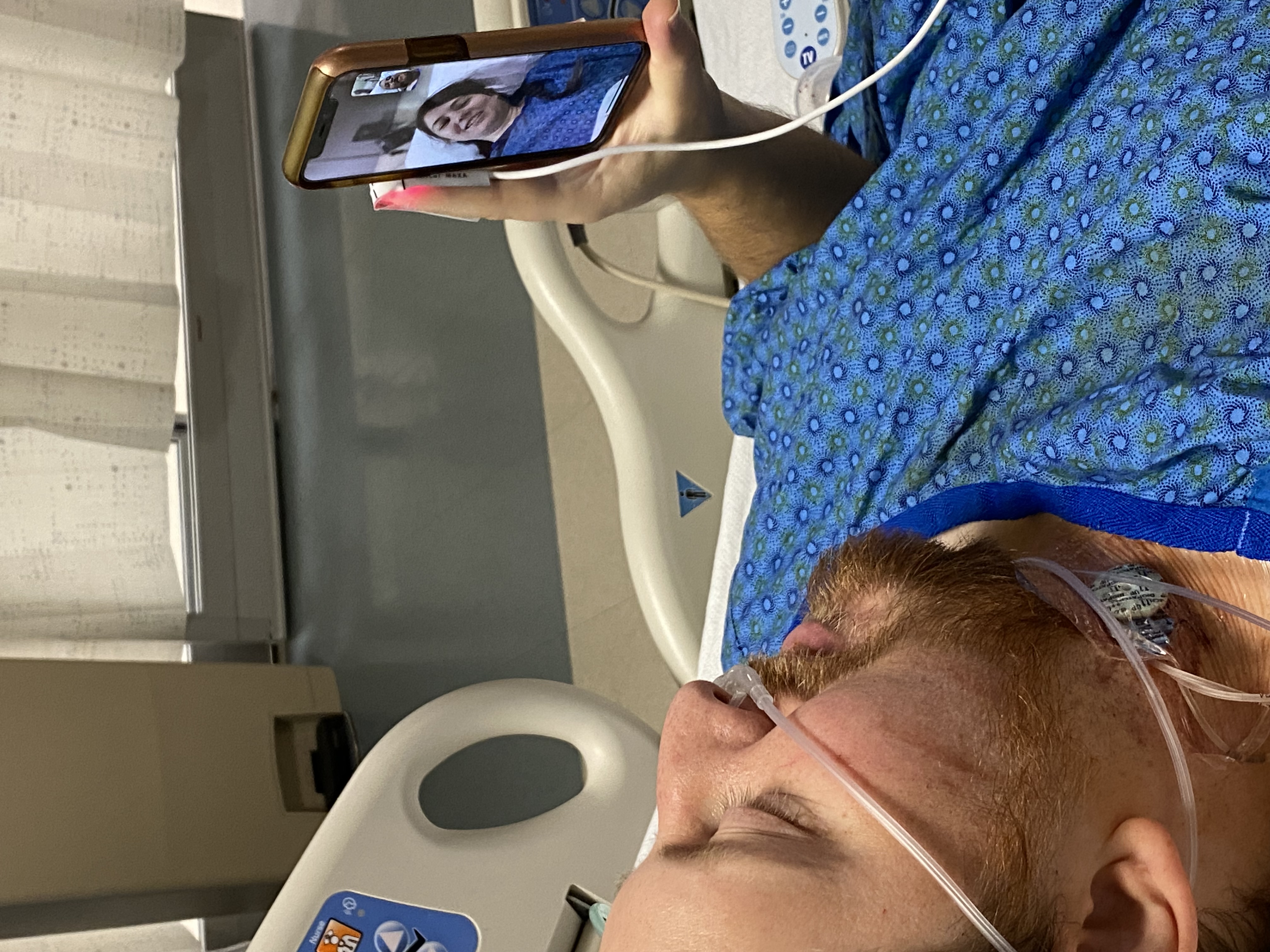 Colin visiting with Kelsey by phone from the hospital