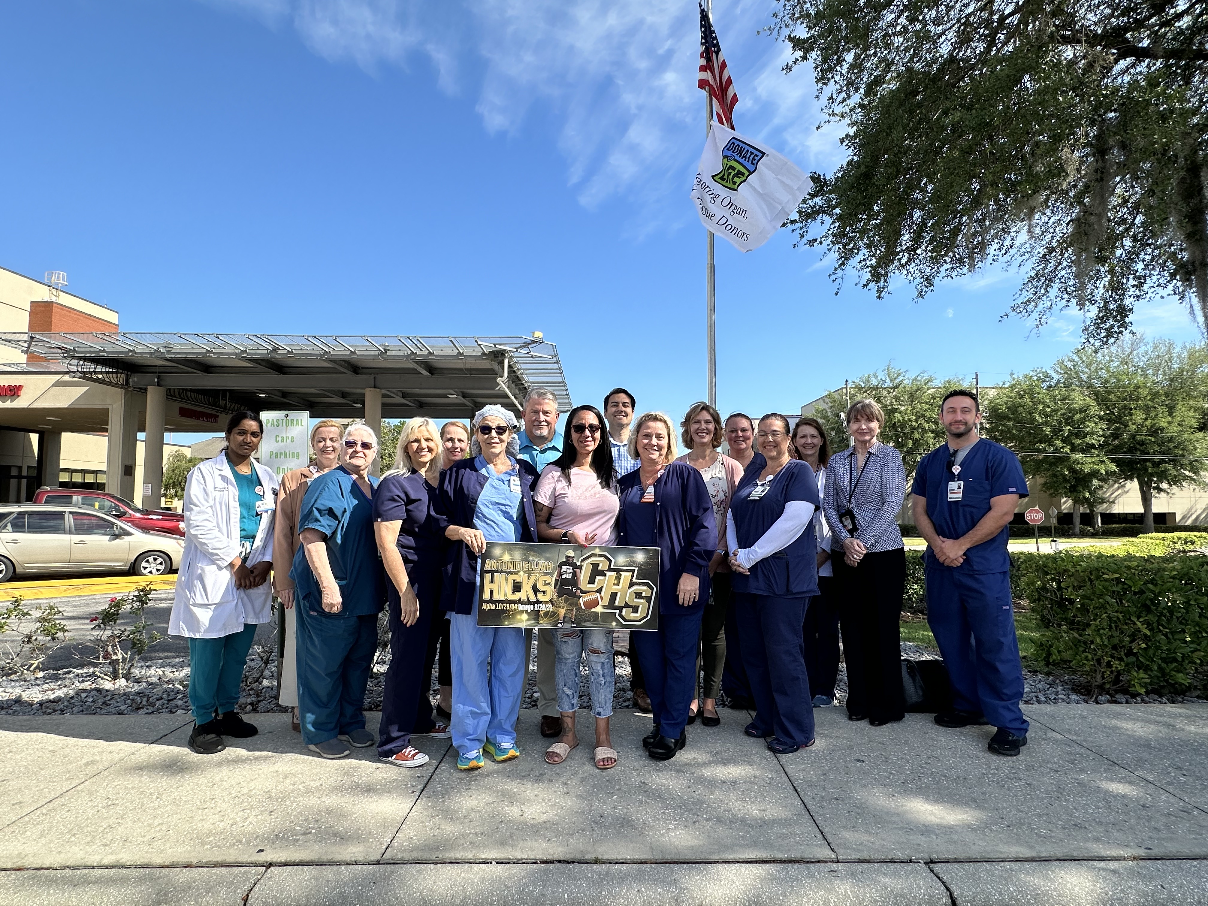 Staff members at HCA Florida Citrus Hospital, along with representatives from local organ, eye and tissue procurement agencies participate in a flag raising ceremony to commemorate that April is Donate Life Month.