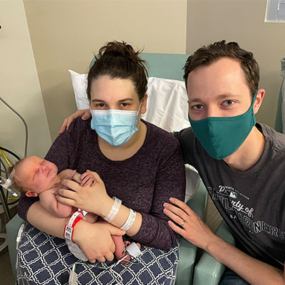 Jessica and Tim Shoop with their newborn daughter, Cynthia Jacqueline.