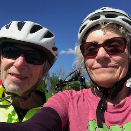 Harvey and Sharon Rishe wearing bike helmets.