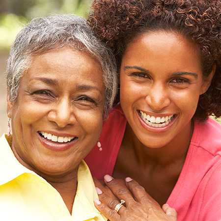 Older smiling woman with younger smiling woman