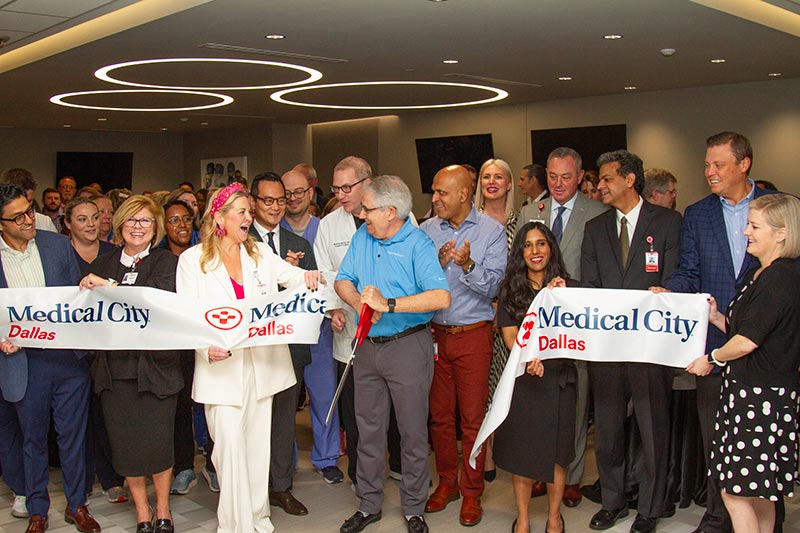 Medical City employees smile and celebrate during a recent ribbon cutting ceremony for the Medical City Dallas Abdominal Transplant Clinic.