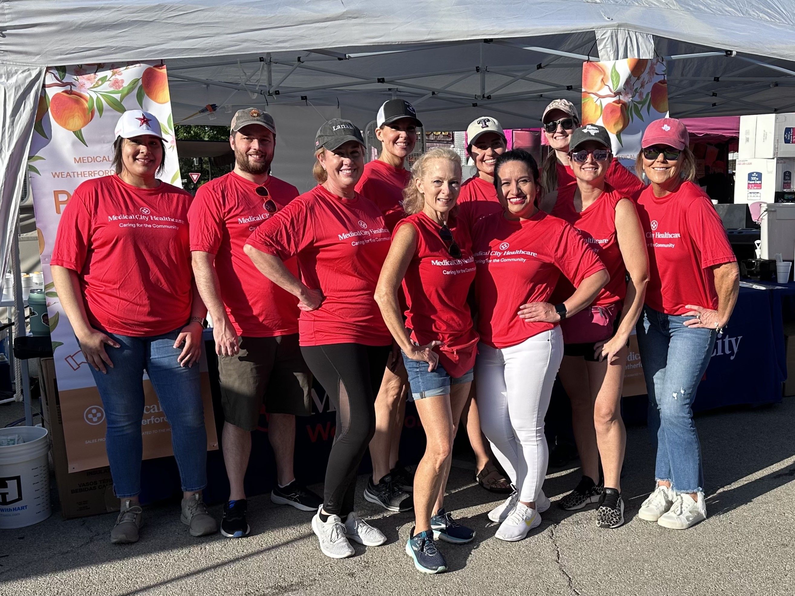Medical City Weatherford colleagues volunteer during the 2024 Parker County Peach Festival.