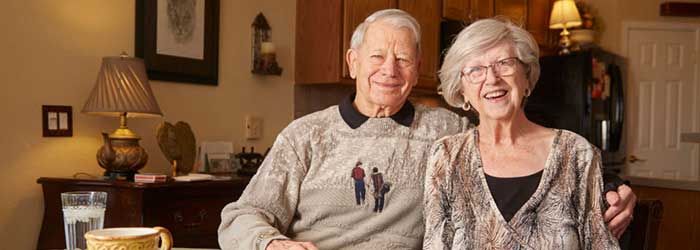 Julia and Orvin Neumeier, seated in their home.