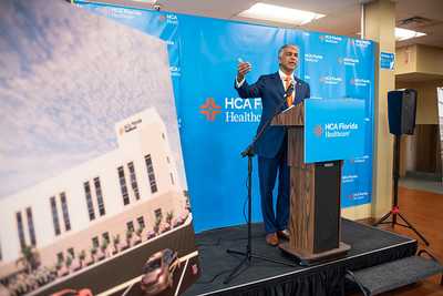 Doctor Ravi Chari, President, HCA West Florida speaking behind a podium. 