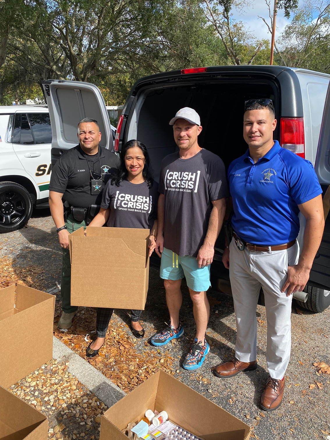 Brandon hospitla staff and local law enforcment load a van with pharmacopia.