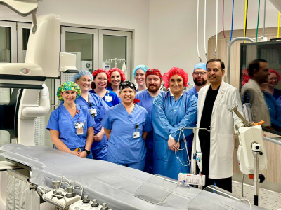 The cardiac cath lab team at Medical City Sachse pose together in a diagnostic room.
