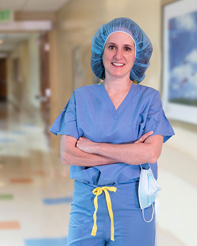 Dr. Kristen Shipman dressed in OR scrubs.