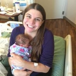Lindsey Schumaker holding her newborn baby.
