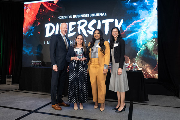 Gurvir Saini, CNO; Latisha Legare, VP of human resources and Nureen Steele, VP of quality accept their facility’s 2023 Diversity in Business Award from Bob Charlet.