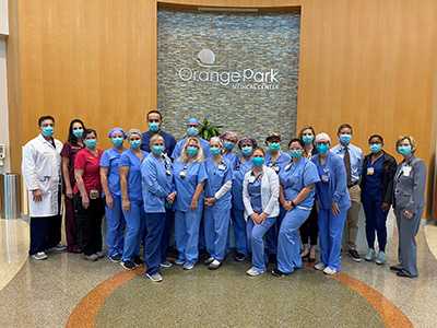 Orange Park Medical Center's cardiac care team posing in the lobby