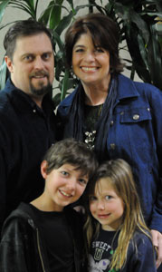 Weight loss patient Shelli with her husband and two children.