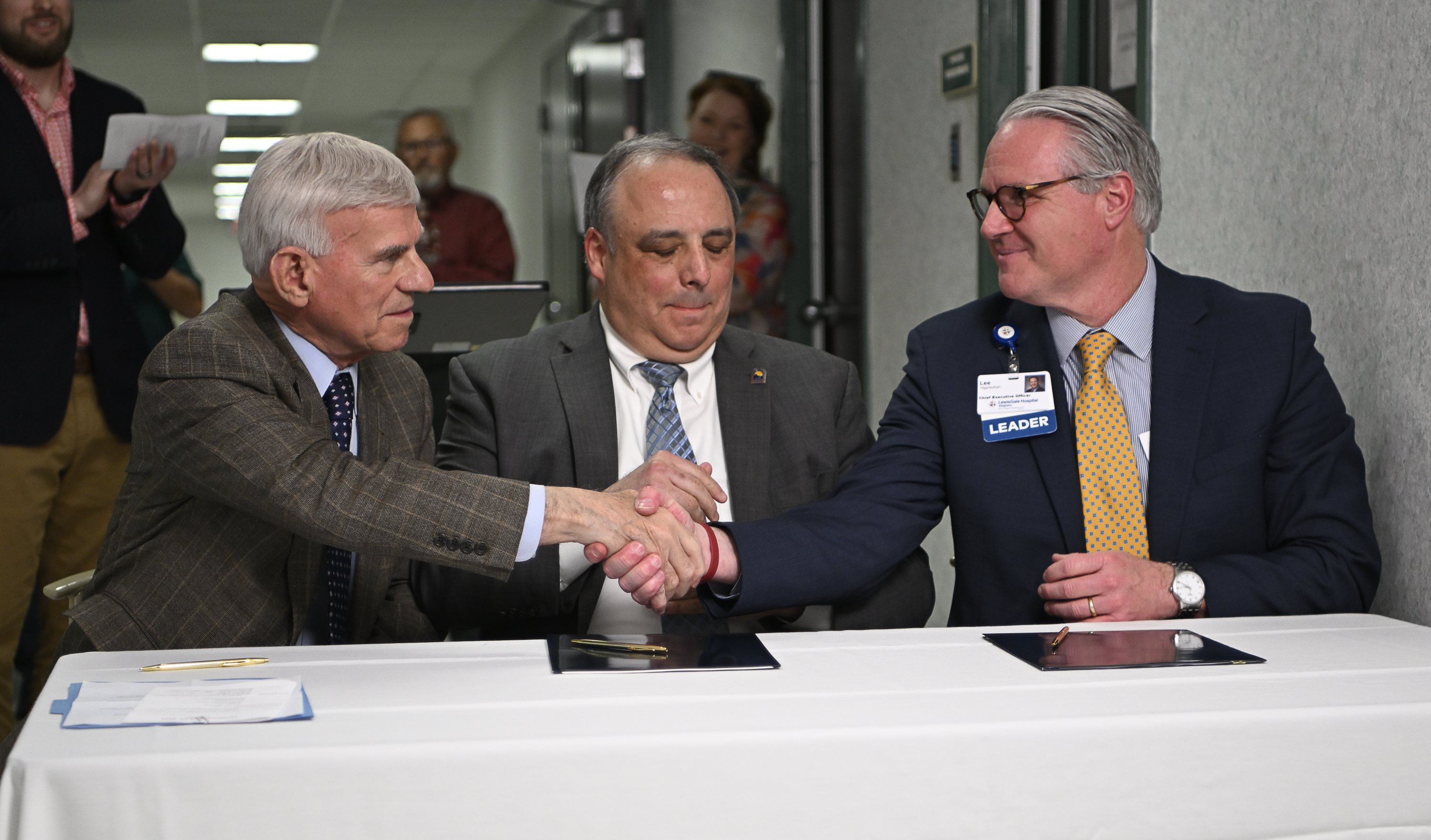 The LewisGale Hospital Alleghany CEO sits with the presidents of Virginia Western Community College and Mountain Gateway Community College to sign official paperwork regarding the new partnership.