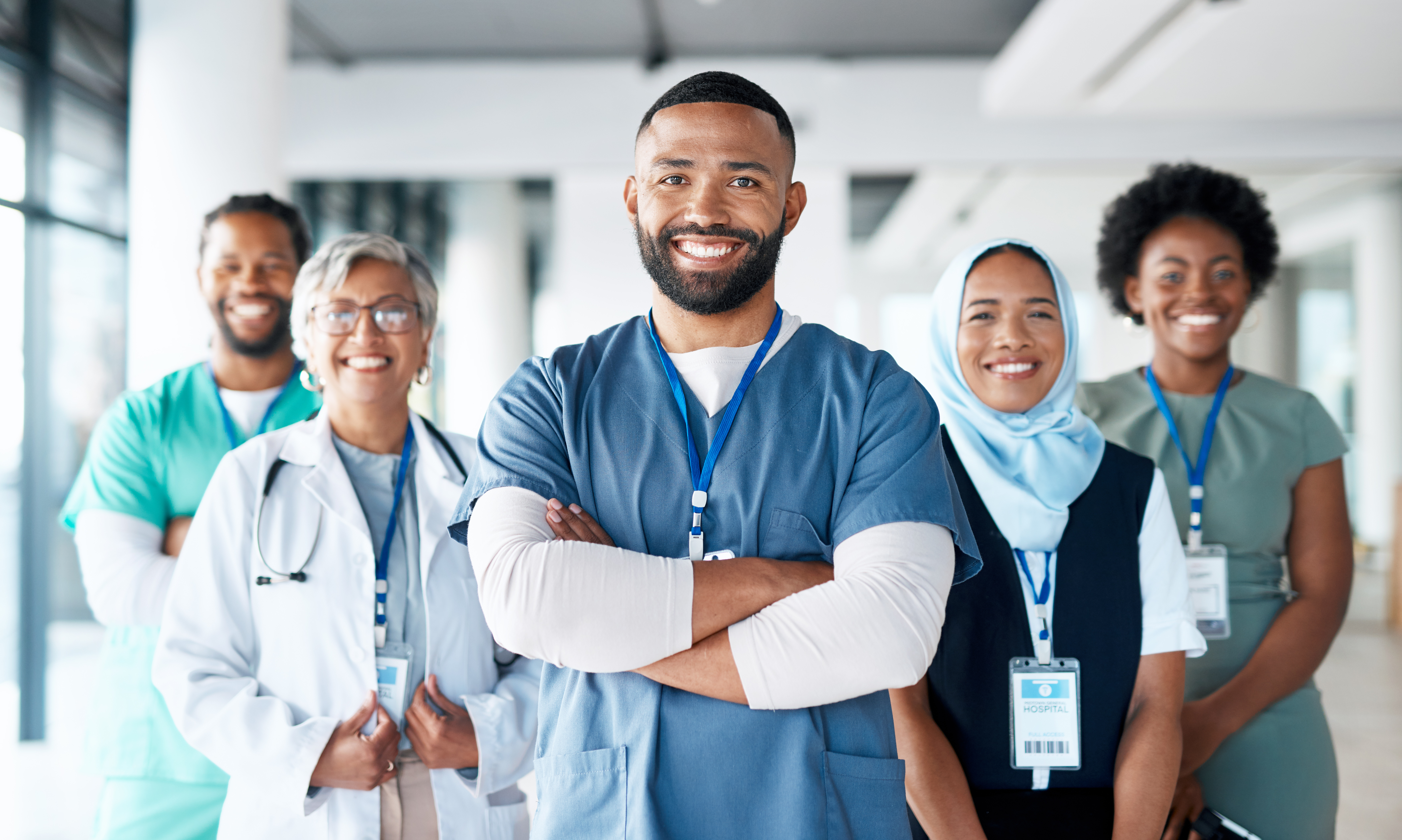 Healthcare, portrait and team of doctors in the hospital standing after a consultation or surgery. Success, confidence and group of professional medical workers in collaboration at a medicare clinic. - stock photo