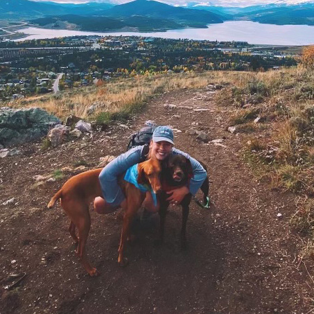 Nina Kennedy, hiking with her dogs.