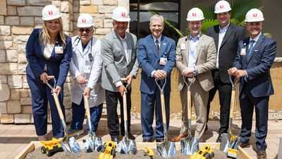 Executive Team break ground with shovels.