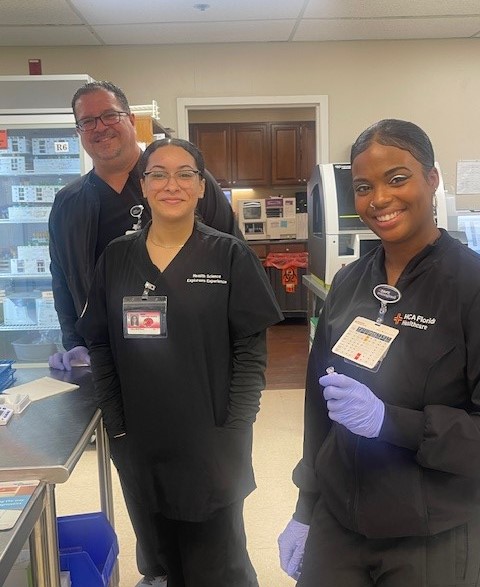 HSE Student, Caila Montilla (center) with the HCA Florida South Tampa Hospital Laboratory team