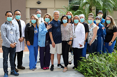 Recovered trauma patient Steven Gauthier with HCA Florida Blake Hospital staff