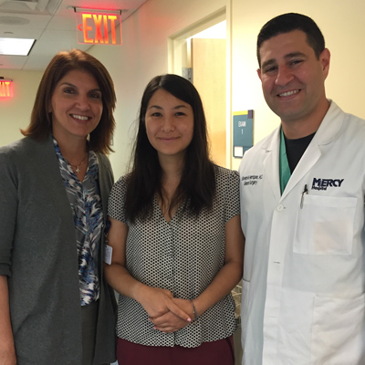Chie with Dr. Henriques and another staff member.